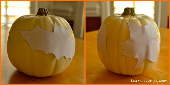 tape stencils to pumpkins