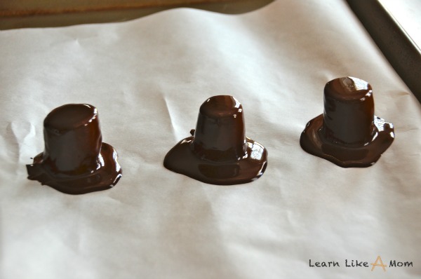 melted chocolate on all bananas for pilgrim hats