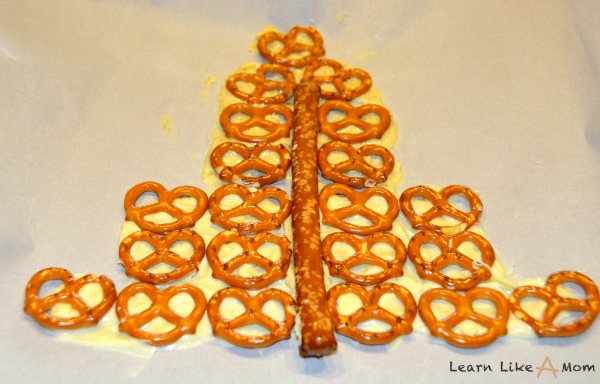 lay pretzels on chocolate for Santa snacks